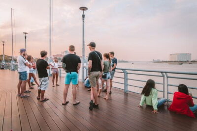 Riverside Walking Tour with Snack, Drinks & Local Ferry Ride - From Mad Monkey to the ferry: how the meetup sets the tone