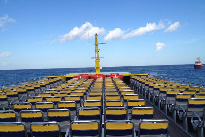 Round Ferry Transfer from Tortugas to Isla Mujeres - Onboard comfort: air-conditioning, TVs, hostess service, and views