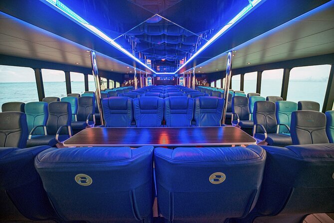 Round Trip Ferry to Isla Mujeres from Cancun - Onboard comfort: restrooms, TVs, bar, and snack options